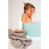 A baby on a bath using bath foam - portrait view