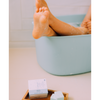 Foot on a powderblue bath tub