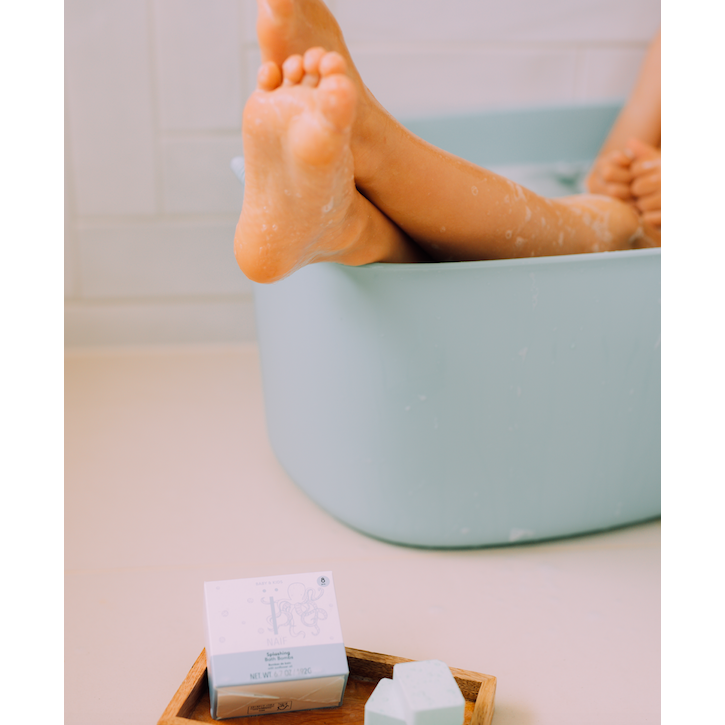 Foot on a powderblue bath tub