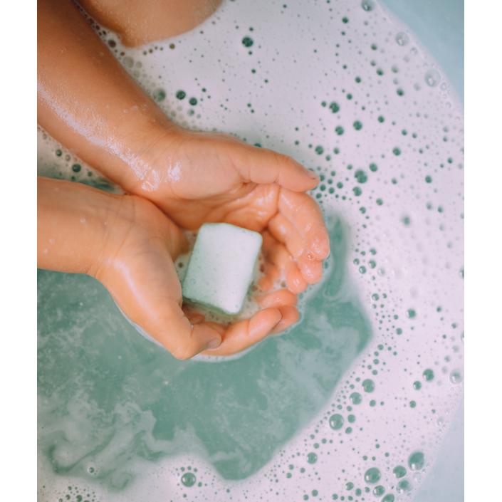 Splashing Bath Bombs Soap on a hands