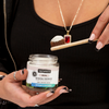 A girl holding the toothbrush with peppermimt & wintergreen truthpaste