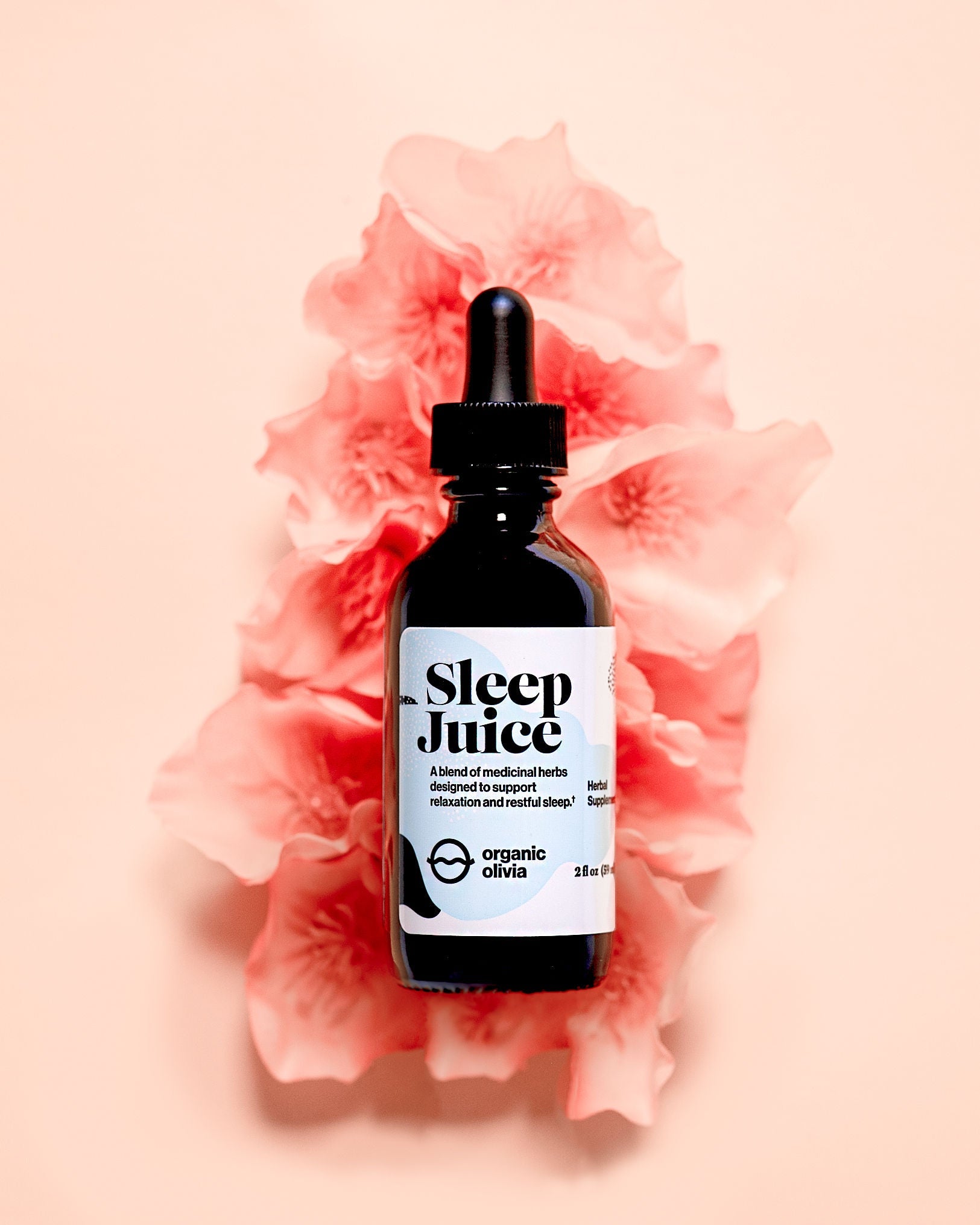 Sleep Juice with a pinkish flower background